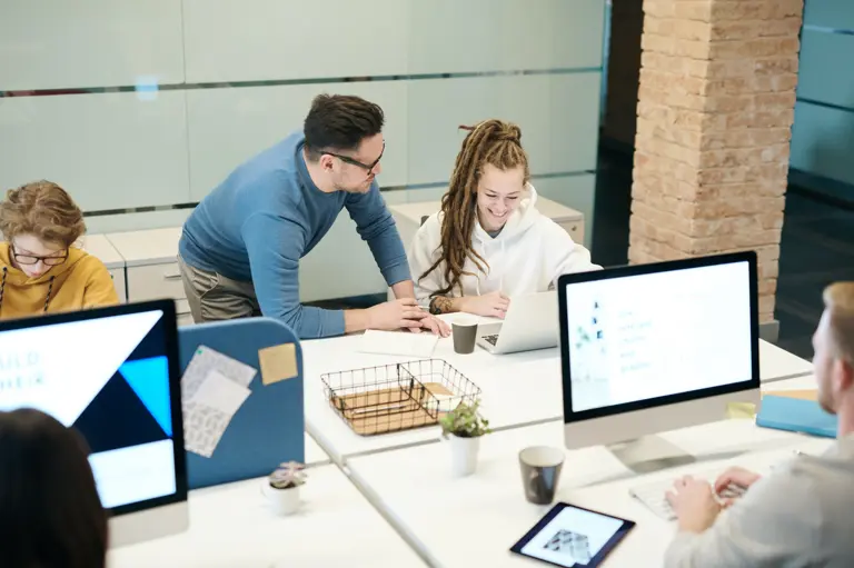 People discussing work in an office setting