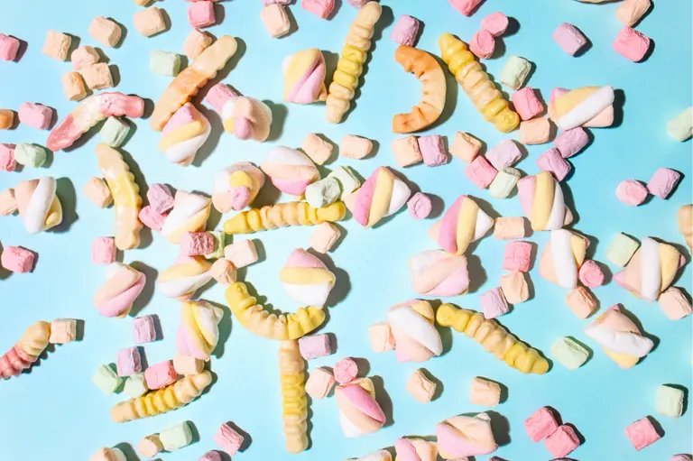 Assorted candies on a light blue background